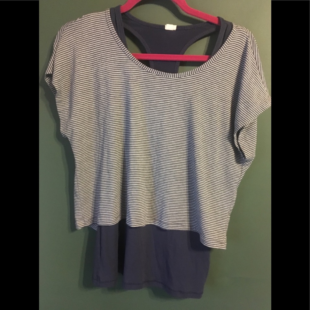 Racerback Tank under a cropped striped t shirt.